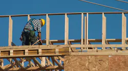 Construction worker with nail gun