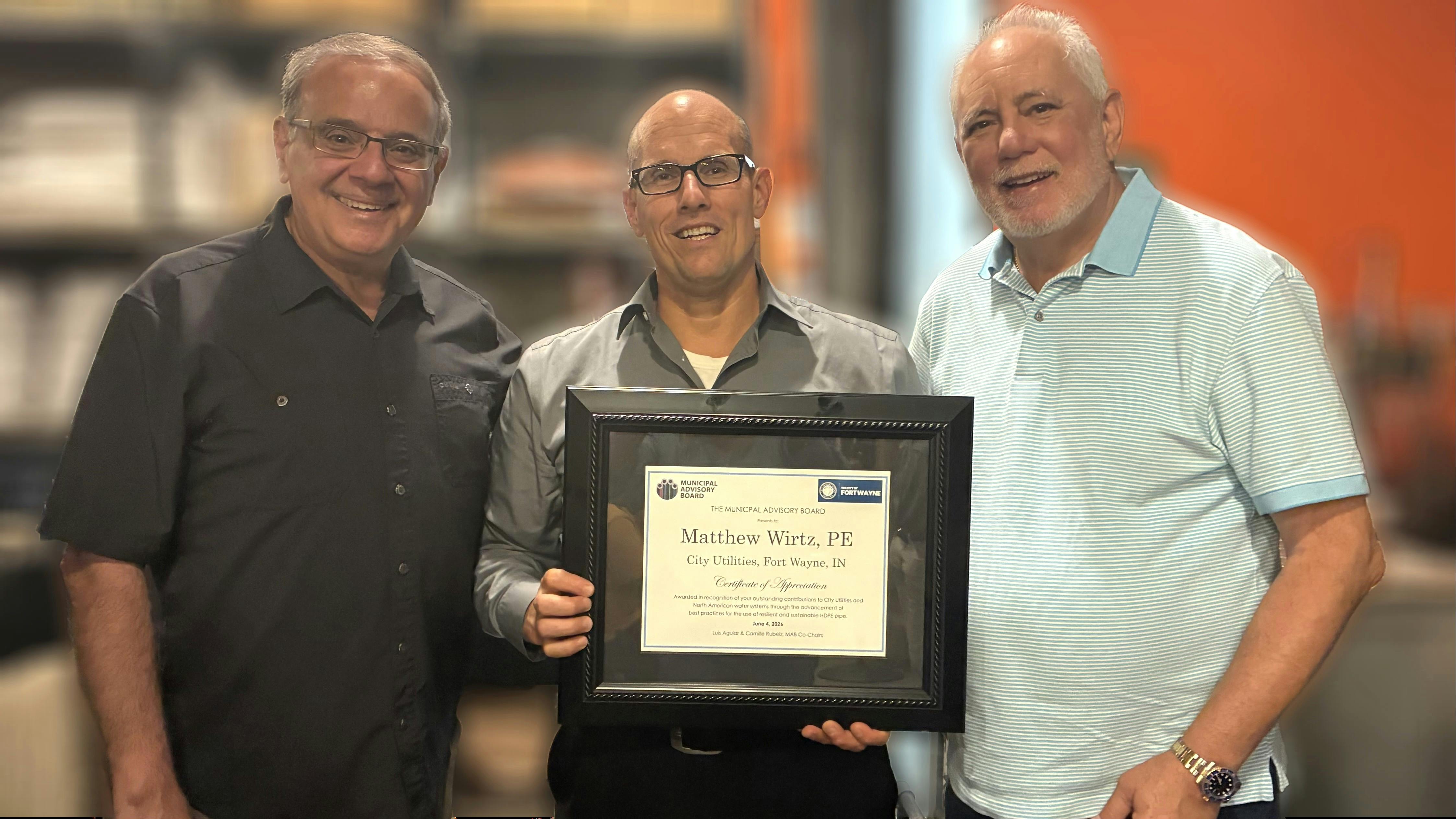 Matthew Wirtz, P.E., Deputy Director/Chief Engineer Fort Wayne City Utilities, Fort Wayne, Indiana (center) receives the Municipal Advisory Board (MAB) Certificate of Appreciation Award from MAB co-chairs Camille George Rubeiz (left) and Luis Aguiar (right).
