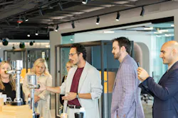 Francisco Barboza Grasa (center), a Spanish designer and engineer and Senior Design Manager – Product & Transportation for Pininfarina of America, discusses flushometers.