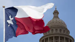 Texas state flag, with the dome of the State Capital in Austin.