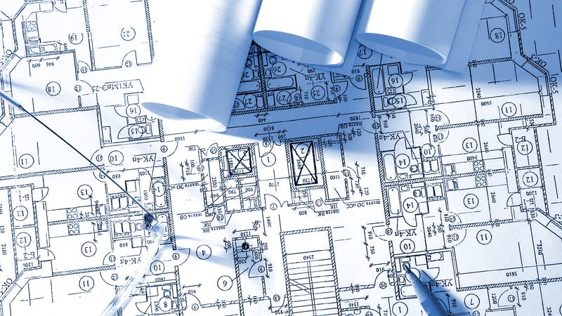 Reviewing a blueprint. Calculations for house building
