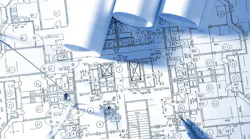 Reviewing a blueprint. Calculations for house building