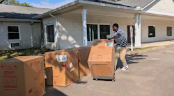 New water heaters being delivered to one of Shelter Equity's group homes.