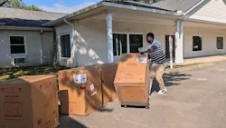 New water heaters being delivered to one of Shelter Equity's group homes.