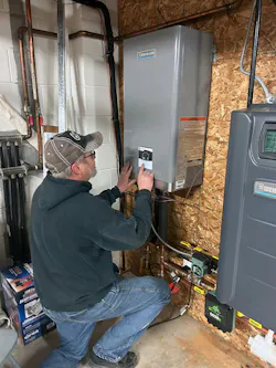 A contractor installing the ECO heat pump.