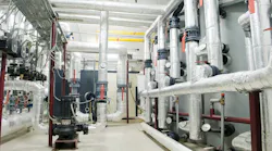 modern gas boiler room with manometers, valves, pumps and thermo-insulation on pipelines