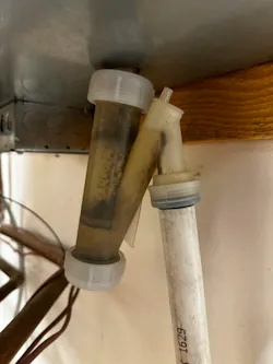 A condensate trap in need of cleaning.