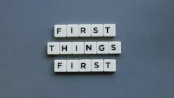 First Things First against a gray background