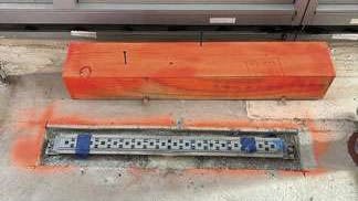 QuickDrain ProLine linear drain body, customized for the tower&rsquo;s resinous flooring application. The drain must be sized, located, and perfectly leveled before the floor is poured.