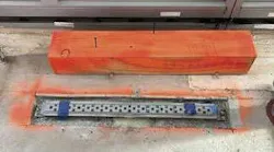 QuickDrain ProLine linear drain body, customized for the tower’s resinous flooring application. The drain must be sized, located, and perfectly leveled before the floor is poured.