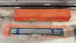 QuickDrain ProLine linear drain body, customized for the tower’s resinous flooring application. The drain must be sized, located, and perfectly leveled before the floor is poured.