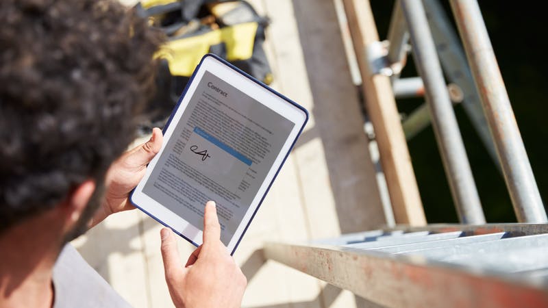 Signature on a tablet at a job site.