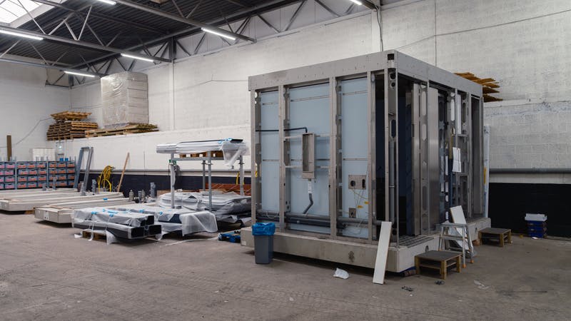 A large prefabricated module ready for transport to the construction site.