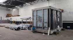 A large prefabricated module ready for transport to the construction site.
