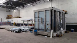 A large prefabricated module ready for transport to the construction site.