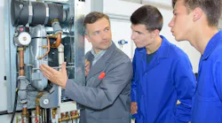Sr. technician explaining a boiler to apprentices