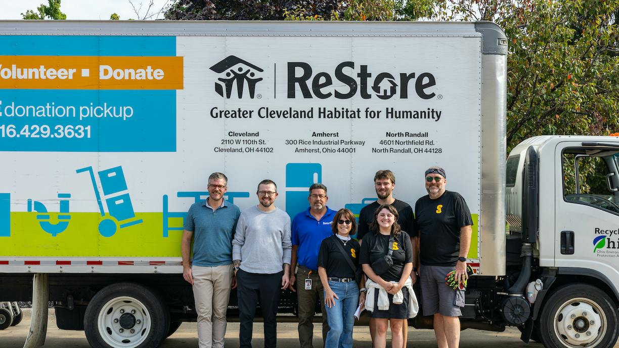 Team Sonnhalter poses in front of a truck full of donations. (Matt Sonnhalter at far right.)