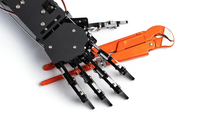 robotic hand reaching for a plumbing wrench