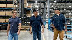 Mike Rowe (center) tours DECKED's Defiance, OH facility.