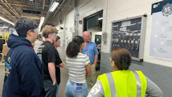 Students on the APCOM facility tour learn about various heating elements manufactured by the company.