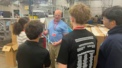 High school students on the APCOM facility tour learn what a dip tube is and how it works.