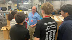 High school students on the APCOM facility tour learn what a dip tube is and how it works.