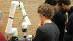 High school students get an up-close view of a manufacturing robot during the A. O. Smith factory tour.