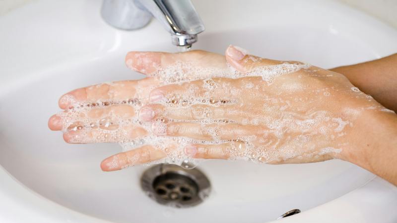 close up of hands washing
