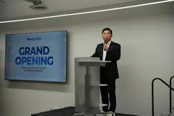 Navien, Inc., CEO TH Kim speaks to attendees during the opening ceremony.