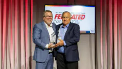 PHCC President Jason Pritchard presents the George D. Scott Award—the Association's highest honor—to Eddie Hollub, president of Modern Plumbing and Air Conditioning, Pasadena, Texas.